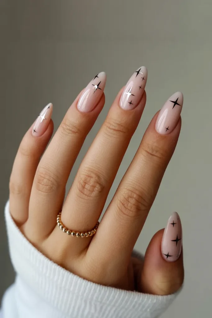 Nude Almond Nails With Tiny Stars