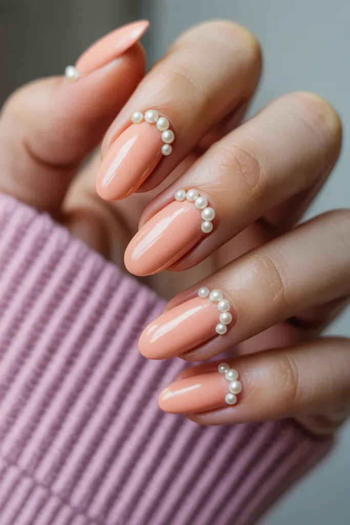 Soft Peach Almond Nails With Pearl Accents